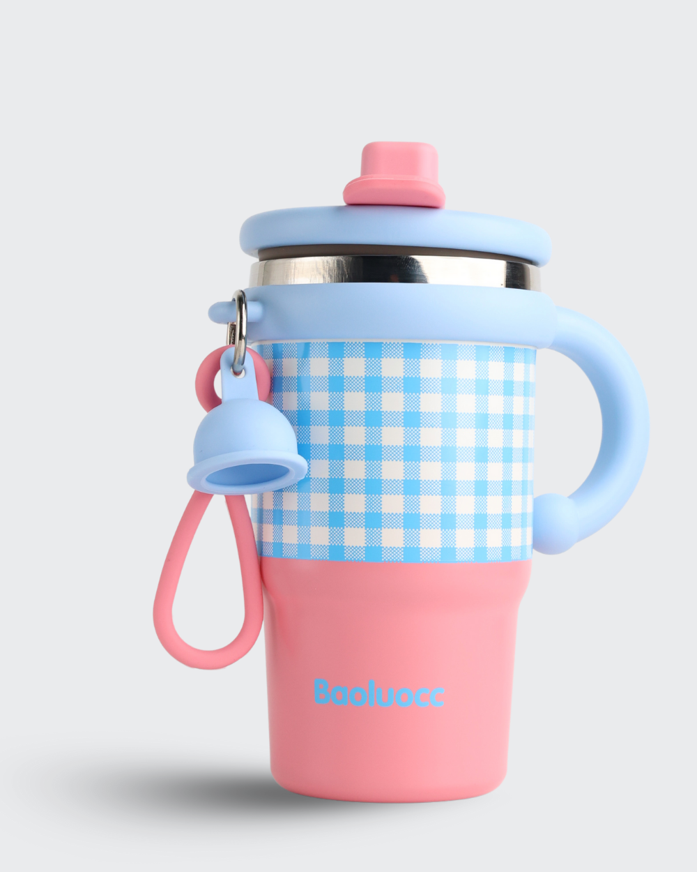 Children's cup with blue handle and pink base on a light gray background