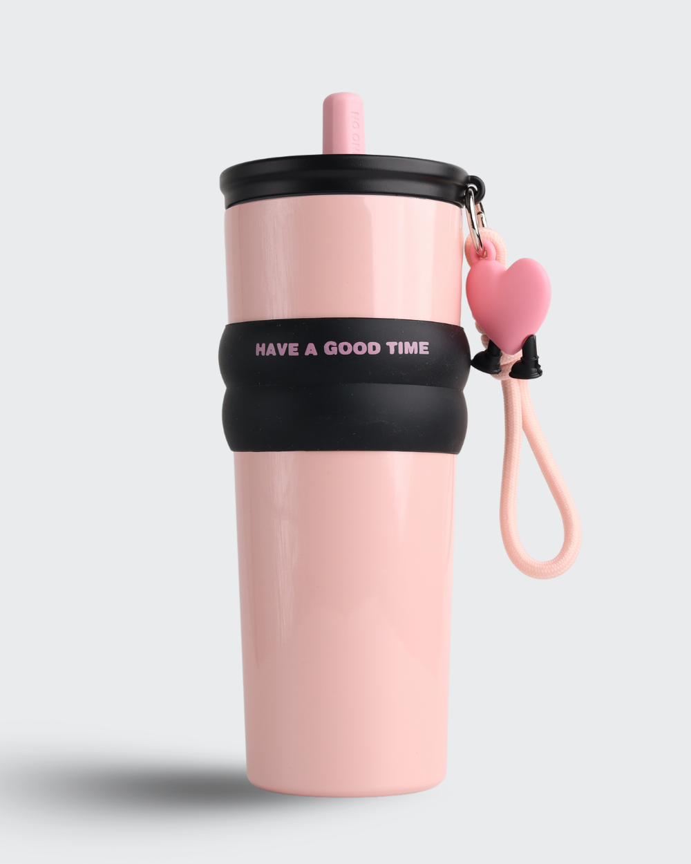 Pink water bottle with black band and heart-shaped keychain on a light gray background