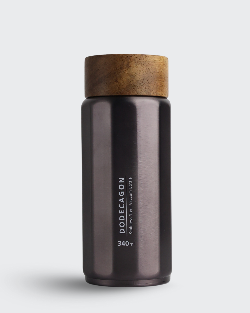 Dark brown thermos bottle with wooden cap on a light gray background