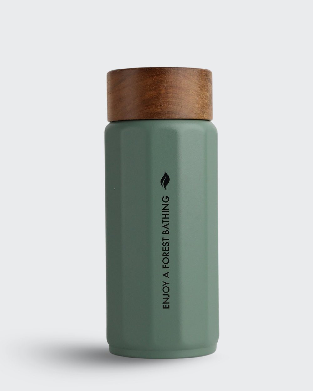 Green thermos bottle with wooden cap on a white background