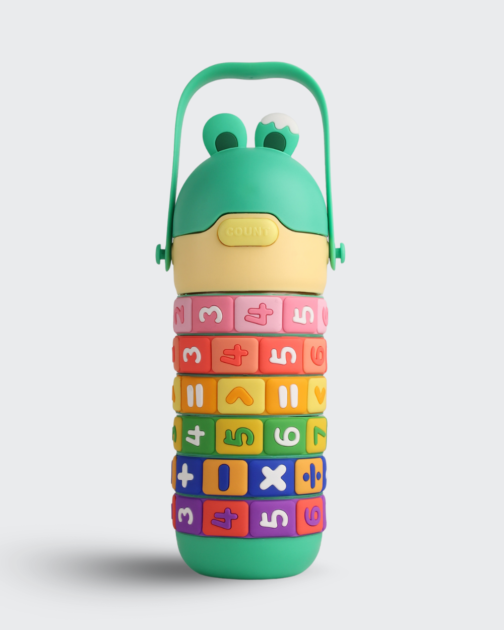 Colorful bottle  with number and letter blocks on a light gray background