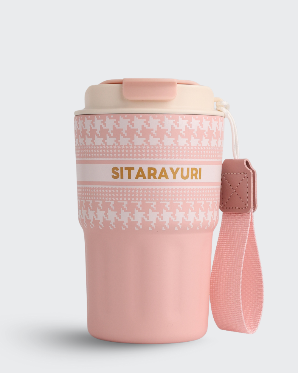 Pink travel mug with white pattern and 'Sitarayuri' branding on a light gray background