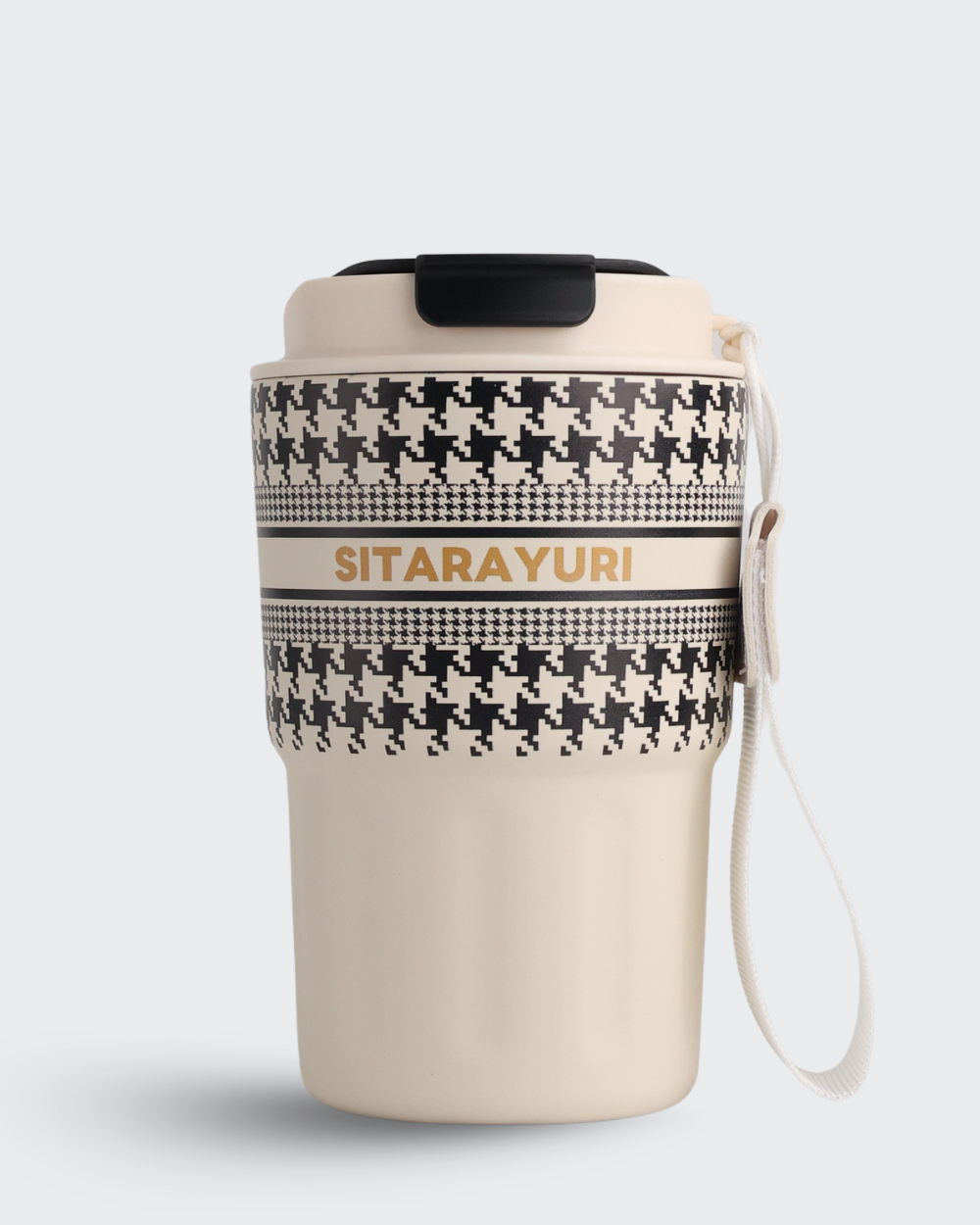 Beige tumbler with black pattern and 'Sitarayuri' branding on a white background