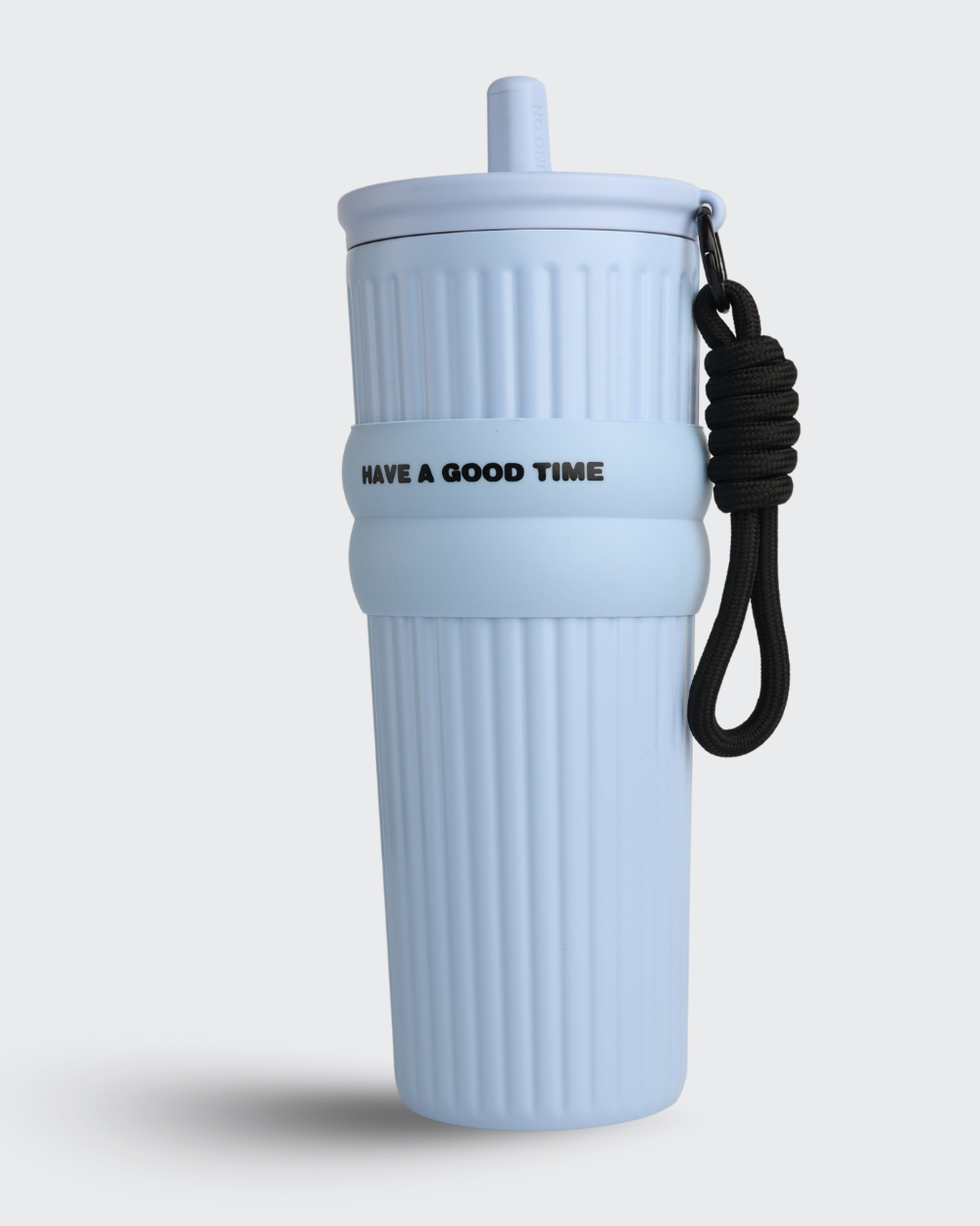 Light blue tumbler with a black strap and 'Have a Good Time' text on a light gray background